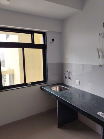 Kitchen in 1 BHK Apartment at Highland Residency CHSL, Balkum Pada – for Sale