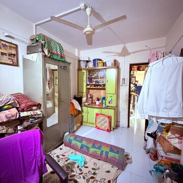 Bedroom in 2 BHK Apartment at Chidanand CHS, Sutarwadi – for Rent