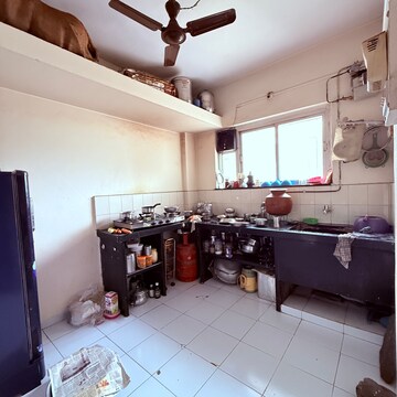 Kitchen in 2 BHK Apartment at Chidanand CHS, Sutarwadi – for Rent