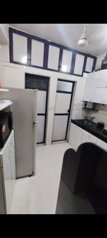 Kitchen in 1 BHK Apartment at Viman Darshan CHS, Andheri East – for Rent
