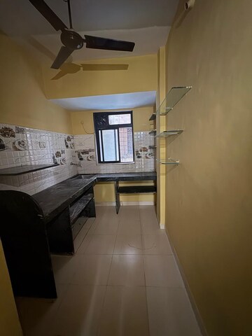 Kitchen in 1 BHK Apartment at Seawoods Sector 50 – for Rent