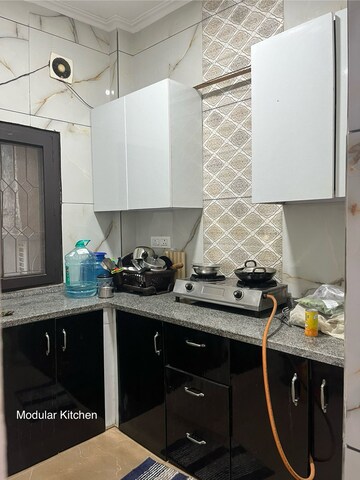 Kitchen in 2 BHK Builder Floor at Esteem Complex, Savitri Nagar – for Rent