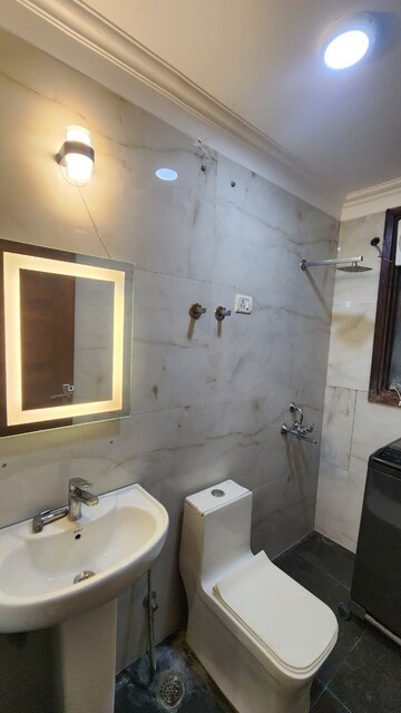 Bathroom in 3 BHK Apartment at Freedom Fighters Enclave – for Rent