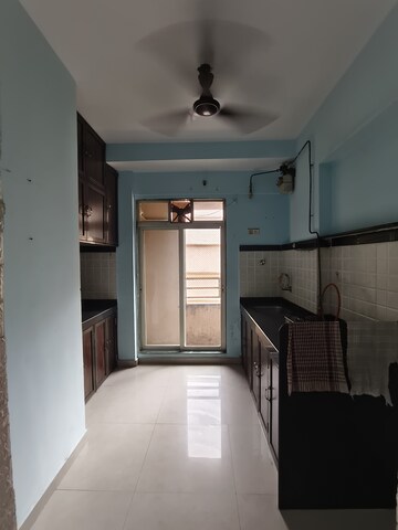 Kitchen in 1 BHK Apartment at Mahavir Kalpavruksha, Ghodbunder Road – for Rent