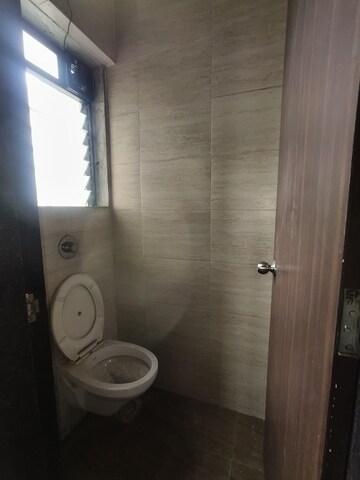 Bathroom in 1 BHK Apartment at Raunak Unnathi Woods Phase 7 A And B, Ghodbunder Road – for Sale