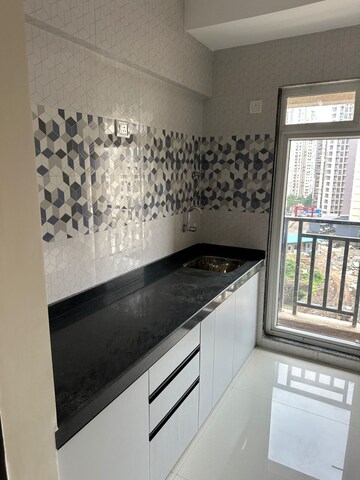 Kitchen in 1 BHK Apartment at Raunak Bliss, Ghodbunder Road – for Rent