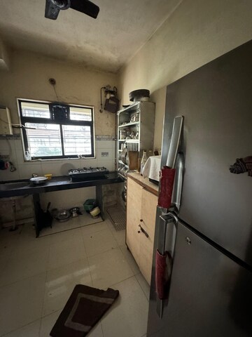 Kitchen in 3 BHK Apartment at Balaji Shriji Apartment CHS, Kopar Khairane – for Sale