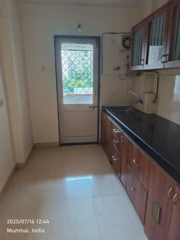 Kitchen in 1 BHK Apartment at Je And Vee Om Trimurti, Malad East – for Sale