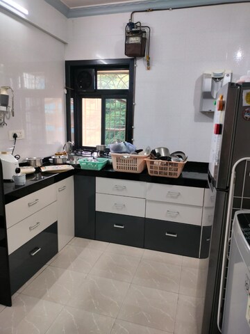 Kitchen in 2 BHK Apartment at Shreeji Tower, Panchsheel Nagar – for Sale