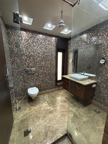 Bathroom in 4 BHK Builder Floor at Green Park Extension – for Rent