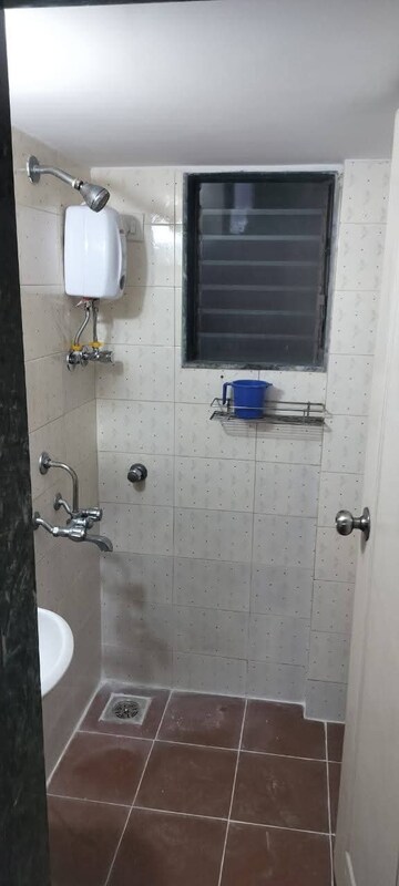 Bathroom in 1 BHK Apartment at Sanjay Gandhi Nagar CHS, Malad East – for Rent