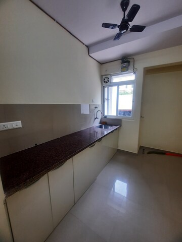 Kitchen in 1 BHK Apartment at Puranik Hometown Phase II, Ghodbunder Road – for Rent