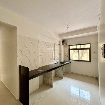 Kitchen in 2 BHK Apartment at Raymond Ten X Habitat, Swastik Garden – for Rent