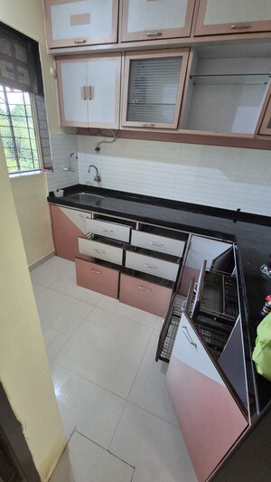Kitchen in 2 BHK Apartment at Raunak Unnathi Woods Phase 7 A And B, Ghodbunder Road – for Sale