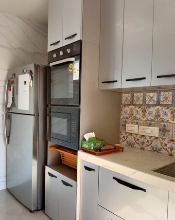 Kitchen in 3 BHK Apartment at Hiranandani Skylark Enclave, Ghodbunder Road – for Rent