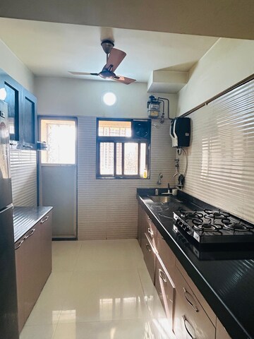 Kitchen in 2 BHK Apartment at Cosmos Jewels, Ghodbunder Road – for Rent
