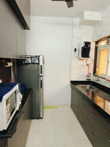 Kitchen in 2 BHK Apartment at Crystal Garden Estate CHS, Manpada – for Rent