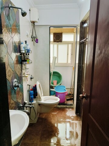 Bathroom in 2 BHK Apartment at Crystal Garden Estate CHS, Manpada – for Rent
