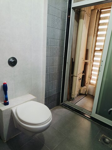 Bathroom in 2 BHK Apartment at Crystal Garden Estate CHS, Manpada – for Rent