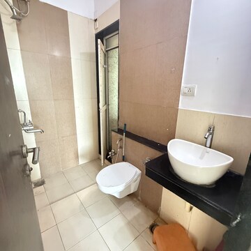 Bathroom in 2 BHK Apartment at Rustomjee Athena, Vrindavan Society – for Rent