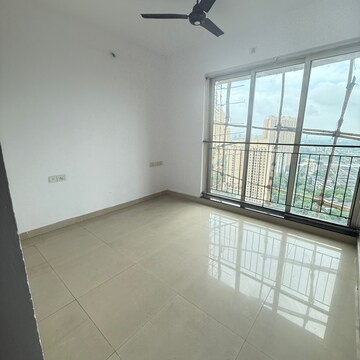 Bedroom in 2 BHK Apartment at Rustomjee Athena, Vrindavan Society – for Rent