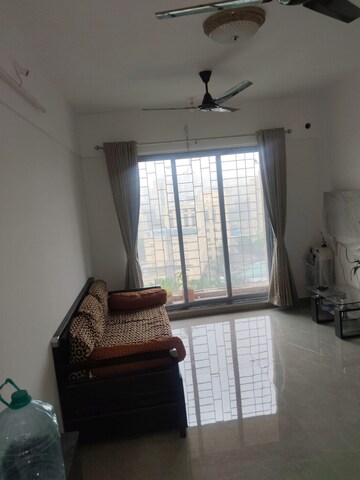 Living Room in 1 BHK Apartment at Cosmos Hilton, Patlipada – for Sale
