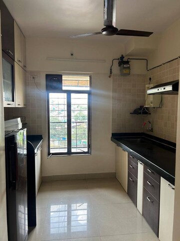 Kitchen in 2.5 BHK Apartment at Rutu Towers, Ghodbunder Road – for Rent