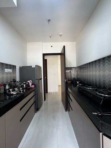 Kitchen in 2 BHK Apartment at Puranik Rumah Bali, Ghodbunder Road – for Rent