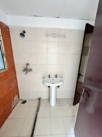 Bathroom in 2 BHK Apartment at Mahagun Mascot, Sain Vihar – for Sale