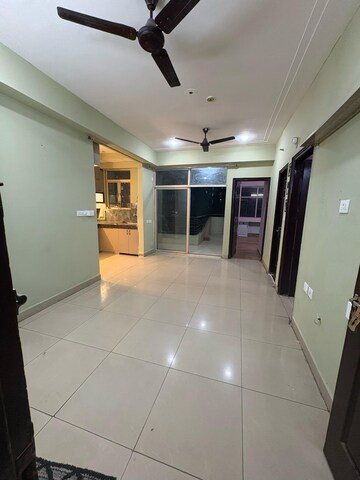 Living Room in 2 BHK Apartment at Mahagun Mascot, Sain Vihar – for Sale