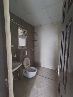 Bathroom in 4 BHK Apartment at Ramprastha Greens – for Sale