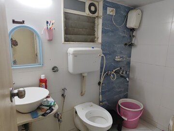 Bathroom in 2 BHK Apartment at Unique Poonam Estate Cluster 2, Mira Road – for Sale
