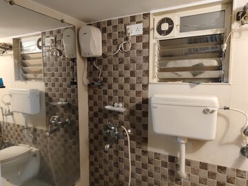 Bathroom in 2 BHK Apartment at Unique Poonam Estate Cluster 2, Mira Road – for Sale