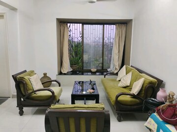 Living Room in 4 BHK Apartment at Nandkutir CHS, Kopar Khairane – for Sale