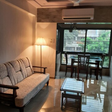 Living Room in 1 BHK Apartment at Manoday CHS, Borivali East – for Rent