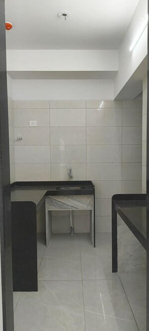 Kitchen in 2 BHK Apartment at Grant Road – for Sale