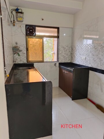 Kitchen in 2 BHK Apartment at Kamla Sukhshanti, Kandivali West – for Sale