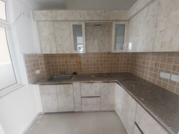 Kitchen in 3 BHK Apartment at Mahagun Mywoods III, Sector 16c Greater Noida – for Rent