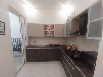Kitchen in 2.5 BHK Apartment at Mahagun Mywoods, Sector 16c Greater Noida – for Rent