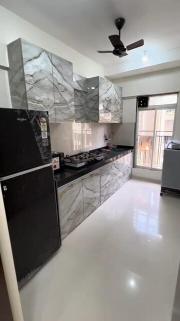 Kitchen in 2 BHK Apartment at Bini Winspace Amelio, Andheri West – for Rent
