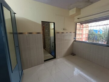 Bedroom in 1 RK Apartment at Swapnapurtii CHS, Poonam Nagar – for Rent