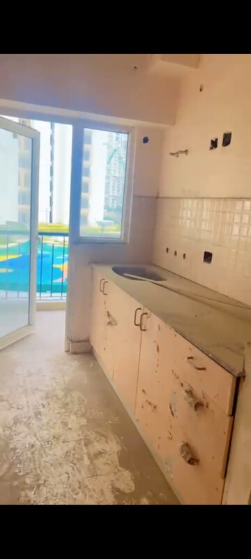 Kitchen in 1 BHK Apartment at Amrapali Dream Valley, Tech Zone 4 Greater Noida – for Sale