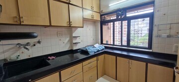 Kitchen in 2 BHK Apartment at Andheri CHS, Andheri West – for Rent
