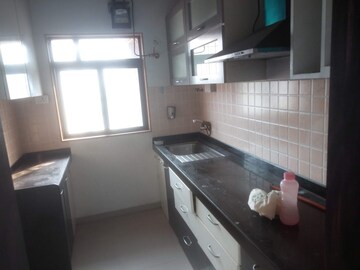 Kitchen in 2 BHK Apartment at Jasmine CHS, Kavesar – for Sale