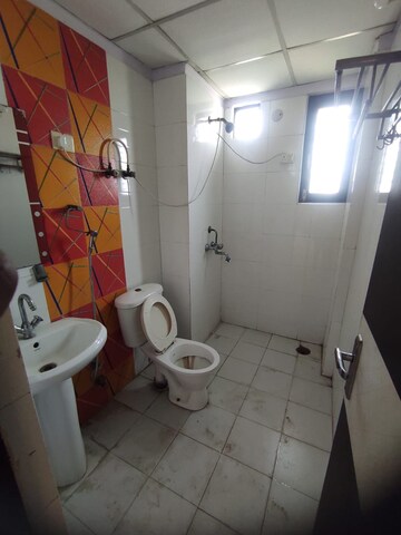 Bathroom in 3 BHK Apartment at Gulmohur Garden, Raj Nagar Extension – for Rent