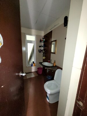 Bathroom in 2 BHK Apartment at Charms Castle, Raj Nagar Extension – for Sale