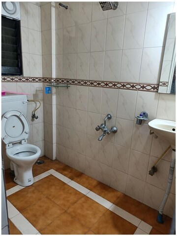 Bathroom in 2 BHK Apartment at Usha Swapna, Prabhat Road – for Rent