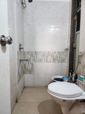 Bathroom in 2 BHK Apartment at Shantinagar CHS, Mira Road – for Sale
