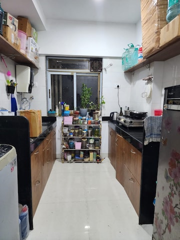 Kitchen in 2 BHK Apartment at Shantinagar CHS, Mira Road – for Sale