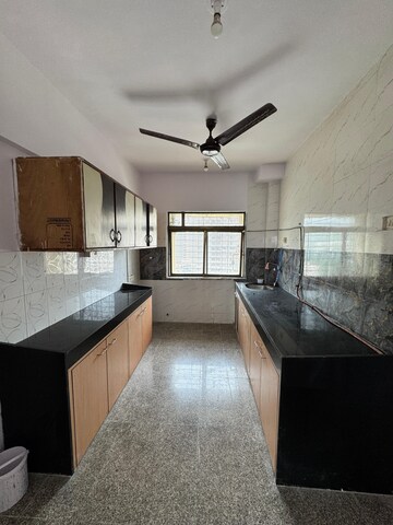 Kitchen in 3 BHK Apartment at Maharaja Retreat CHS, Goregaon East – for Rent
